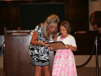 First place winner, Victoria Landeros accepting her award. Victoria is a kindergartner from Hunt Elementary.