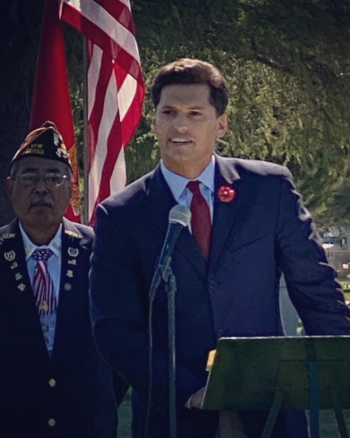 Channce Condit speaking at a podium at the Ceres Memorial Day Ceremony in 2021