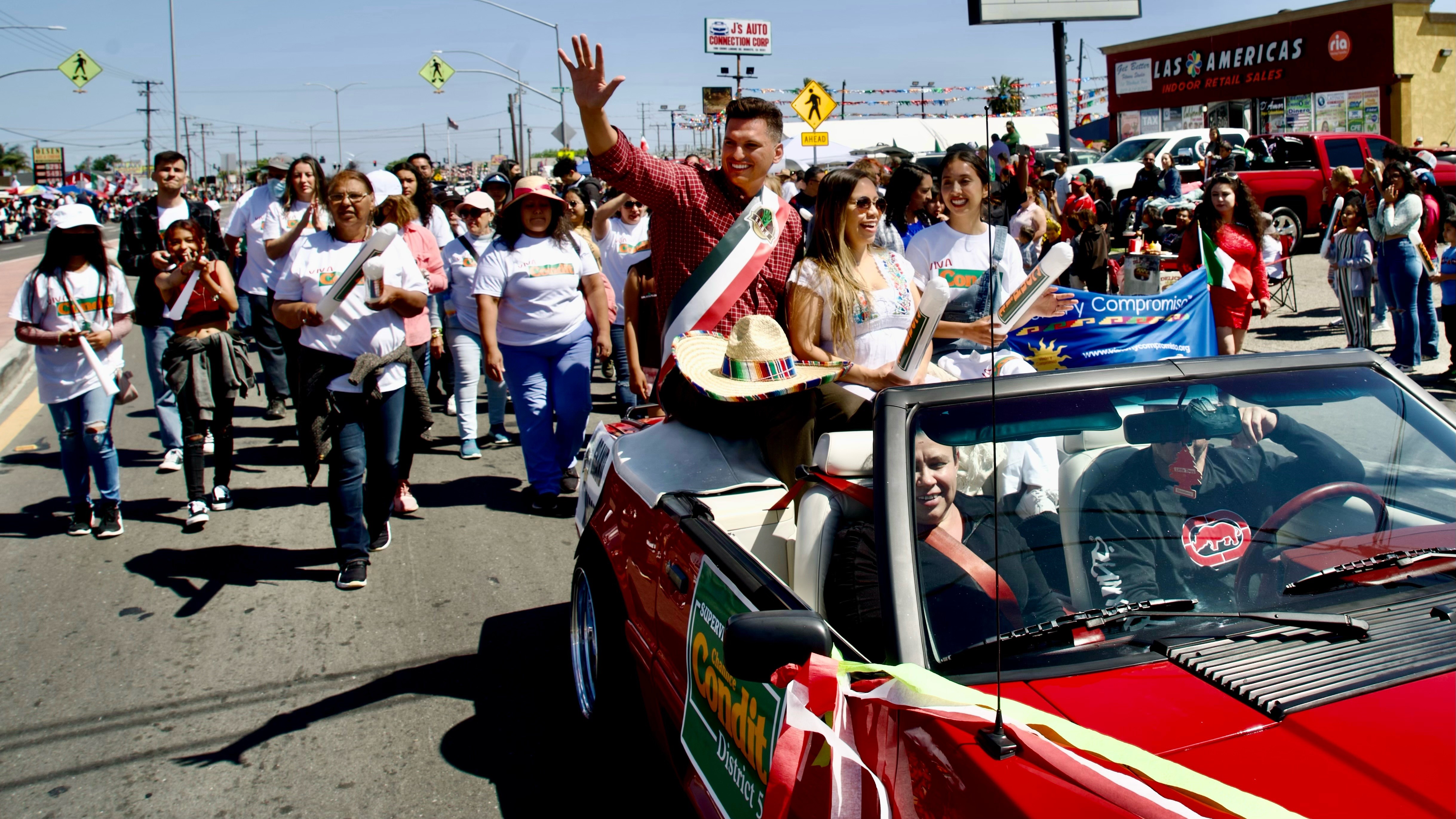 Channce Condit riding in a car during the South Modesto Business United Cinco de Mayo parade in 2022