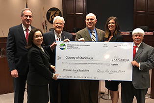 olsen kristin district installment receives funds measure